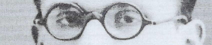 Part of the face of Kurt Gödel; his eyes and glasses