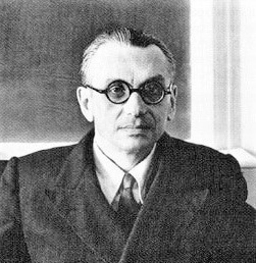 Kurt Gödel, black and white, head with glasses wearing a suit