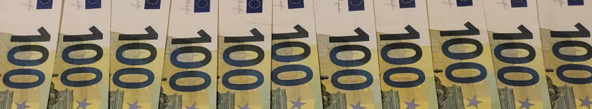 Several hundred euro bills in green yellow_ side by side